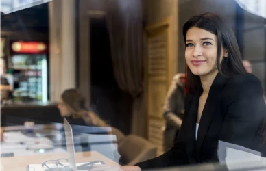 Finance professionals analyzing risk management data and compliance reports in a Dubai financial firm